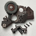 Mechanical parts including gears and metal components on a light gray background